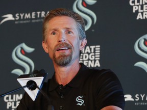 New Seattle Kraken head coach Dave Hakstol listens during a news conference, Thursday, June, 24, 2021 in Seattle.