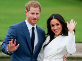 Prince Harry and Meghan Markle pose for a photograph in the Sunken Garden at Kensington Palace in west London on Nov. 27, 2017.