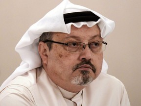 In this file photo taken Dec. 15, 2014, Saudi journalist Jamal Khashoggi attends a press conference in Manama, Bahraini.