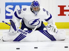 Tampa Bay Lightning goaltender Andrei Vasilevskiy stretches ahead of Game 5 against the Carolina Hurricanes on Tuesday. With a 29-save, 2-0 win, he became the first goaltender in NHL history to string together three consecutive series clinching shutouts.