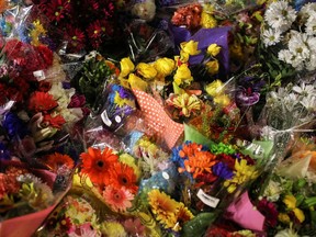 Flowers are seen at a makeshift memorial at the fatal crime scene where a man driving a pickup truck jumped the curb and ran over a Muslim family in what police say was a deliberately targeted anti-Islamic hate crime, in London, Ontario.