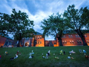 Pairs of children's shoes and toys are seen at a memorial in front of the former Kamloops Indian Residential School after the remains of 215 children, some as young as three years old, were found at the site.