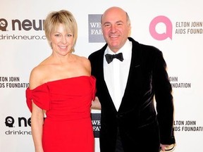 Businessman and television personality Kevin O'Leary and his wife Linda arrive at the 2014 Elton John AIDS Foundation Oscar Party in West Hollywood, California March 2, 2014.