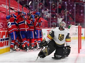 Montreal Canadiens forward Artturi Lehkonen (62) celebrates with teammates after scoring a goal against Vegas Golden Knights goalie Robin Lehner (90) during the overtime period in game six of the 2021 Stanley Cup Semifinals at the Bell Centre.