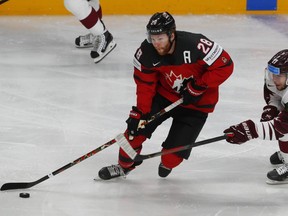 Canada's Connor Brown in action with Latvia's Martins Dzierkals.