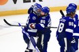 Tampa Bay Lightning forward Nikita Kucherov (right) hugs goalie Andrei Vasilevskiy after defeating the Montreal Canadiens in Game 2 of the Stanley Cup final.