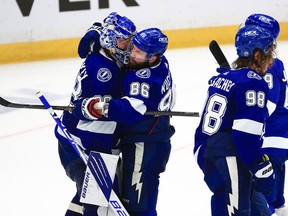 Tampa Bay Lightning forward Nikita Kucherov (right) hugs goalie Andrei Vasilevskiy after defeating the Montreal Canadiens in Game 2 of the Stanley Cup final.