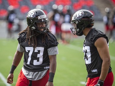 The Ottawa Redblacks returned to the field on Sunday, July 11, 2021, for the club's first practice of this year's training camp. Defensive linemen James Crawford and Reshaan Davis during training camp Sunday.