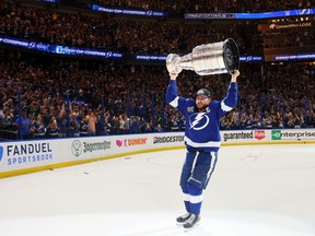 Steven Stamkos of the Tampa Bay Lightning hoists the Stanley Cup after the 1-0 victory against the Montreal Canadiens in Game 5.