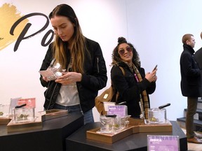 Customers and staff at the Hunny Pot Cannabis Co. retail cannabis store in Toronto on April 1, 2019.