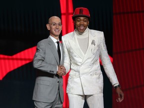Scottie Barnes (Florida State) poses with NBA commissioner Adam Silver after being selected as the number four overall pick by the Toronto Raptors on Thursday.