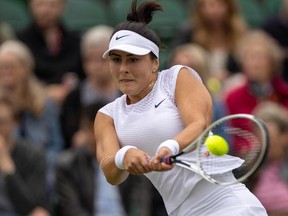 Canada's Bianca Andreescu returns against France's Alize Cornet during their women's singles first round match on the third day of the 2021 Wimbledon Championships at The All England Tennis Club in Wimbledon, southwest London, on June 30, 2021.