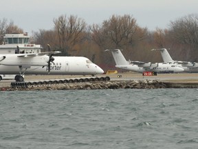 Aircraft belonging to Porter Airlines sit parked at Billy Bishop airport on March 28, 2020.