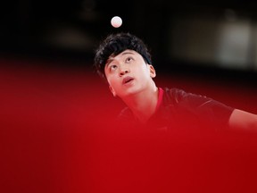 Jeoung Youngsik of Team South Korea serves the ball during his Men's Singles Quarterfinals table tennis match on day five of the Tokyo 2020 Olympic Games at Tokyo Metropolitan Gymnasium on July 28, 2021 in Tokyo, Japan.