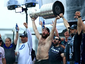 Nikita Kucherov, centre, of the Tampa Bay Lightning celebrates during the Stanley Cup victory rally at Julian B. Lane Riverfront Park on July 12, 2021 in Tampa, Fla.