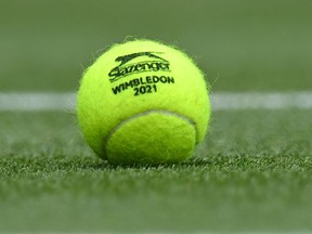 A tennis ball on the court during the tenth day of the 2021 Wimbledon Championships at The All England Tennis Club in Wimbledon, southwest London, on July 8, 2021.