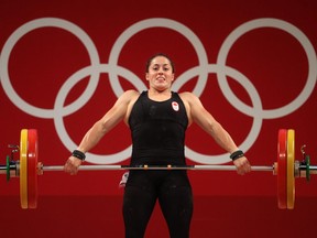 Maude Charron of Team Canada competes during weightlifting in the women's 64kg weight class.