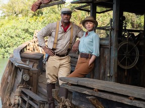 Dwayne Johnson as Frank and Emily Blunt as Lily in Jungle Cruise.