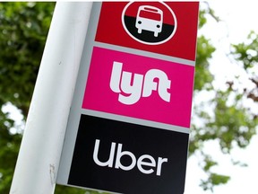 A sign marks a rendezvous location for Lyft and Uber users.