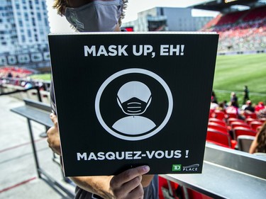 TD Place staff had signs to remind patrons to keep their masks on, to follow COVID-19 protocols.
