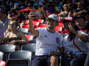 Spectators shooting a taking a selfie at Atlético Ottawa's first home game against the HFX Wanderers FC in the first game in front of fans Saturday, August 14, 2021, at TD Place.