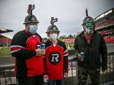 Craig Dawson, left, his son 15-year-old Owen Dawson who was celebrating his birthday, and Ghyslin Titley were among the Redblacks fans at Saturday's game.
