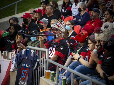 OTTAWA -- August 28, 2021 -- The Ottawa Redblacks host the BC Lions during Ottawa's Bill Daines, in the helmet and decked out in gear, sits in the seat he has had since day one of the Redblacks franchise in 2014.
