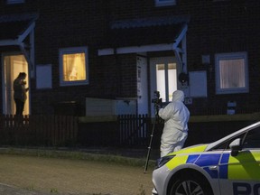 Police on the the scene following a shooting in Keyham on August 12, 2021 in Plymouth, England.