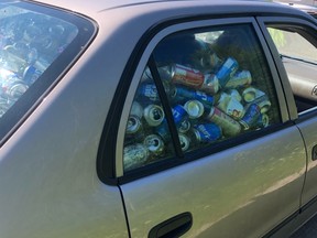 Car stopped at RIDE spotcheck full to the brim with empty beer cans