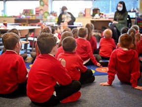 Pupils at Cleeves Primary School return to the classroom on February 22, 2021 in Glasgow, Scotland.