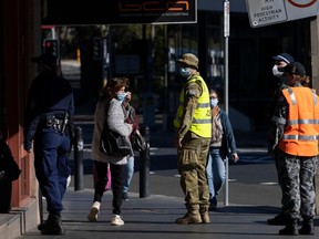 Australian Defence Force soldiers and members of the New South Wales Police Force patrol in the Bankstown CBD on August 07, 2021 in Sydney, Australia.