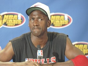 Guard Michael Jordan of the Chicago Bulls speaks reporters during a practice before a playoff game against the Utah Jazz at the Delta Center in Salt Lake City, Utah.