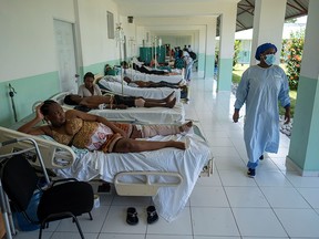 People injured after Saturday's 7.2 magnitude quake are seen on hospital beds in the Ofatma hospital corridor after it suffered structural damage, in Les Cayes, Haiti August 18, 2021.