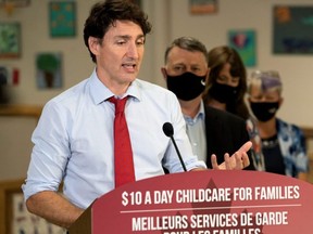 Prime Minister Justin Trudeau speaks to members of the media as Prince Edward Island Premier Dennis King watches at the daycare inside Carrefour de l'Isle-Saint-Jean school in Charlottetown, P.E.I., July 27, 2021.