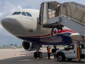 A Canadian Armed Forces CC-150 Polaris aircraft carrying Afghan refugees who supported Canada's mission in Afghanistan arrives at Toronto Pearson International Airport in Mississauga on Aug. 13, 2021.