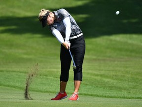 Canada's Brooke Henderson plays a shot on the fairway of the 8th hole in round 3 of the womens golf individual stroke play during the Tokyo 2020 Olympic Games at the Kasumigaseki Country Club in Kawagoe on August 6, 2021.