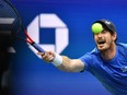 Britain's Andy Murray hits a return to Greece's Stefanos Tsitsipas during their 2021 US Open Tennis tournament men's singles first round match at the USTA Billie Jean King National Tennis Center in New York, on August 30, 2021.
