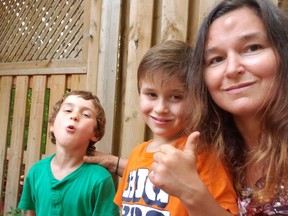 Chantal Vicha with sons Alexandre, 5, and Luca, 8, who head back to Trille des Bois elementary school in Ottawa on Aug. 31. The kids are eager to get back to in-person classes and see their friends, while their mother says it will allow her to go back to school  herself this fall.