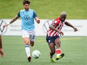 Atlético Ottawa's Myles Cornwall, right, in action against Halifax on Sunday, Aug. 29, 2021.