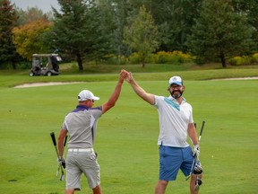 Brad Kerfoot (left) and partner Joel Michaud won the Ottawa Sun Scramble's The Open Division Sunday at The Marshes, finishing at 22-under over 36 holes.