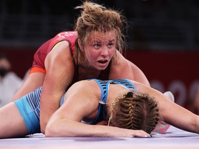 Epp Maee of Team Estonia competes against Erica Elizabeth Wiebe of Team Canada during the Women's Freestyle 76kg 1/8 Final on day nine of the Tokyo 2020.