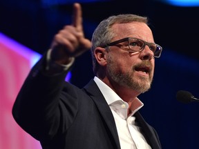 Brad Wall, former premier of Saskatchewan speaks at the United Conservative Party's 2018 annual general meeting and founding convention in Red Deer, May 5, 2018.