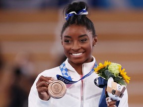 Simone Biles of Team United States poses with the bronze medal during the Women's Balance Beam Final medal ceremony on day eleven of the Tokyo 2020 Olympic Games at Ariake Gymnastics Centre on Aug. 3, 2021 in Tokyo.