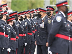 Chief Peter Sloly inspects the new officers of the Ottawa Police Service during the formal badge ceremony held at Lansdowne Park on Wednesday.
