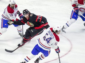 Ottawa Senators' Egor Sokolov battles Canadiens' Tory Dello (left) and Brendan Sirizzotti.