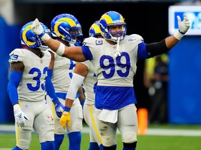Los Angeles Rams defensive lineman Aaron Donald is all smiles as he gestures to the crowd during Sunday's win over Tampa Bay.