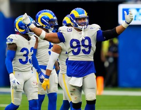 Los Angeles Rams defensive lineman Aaron Donald is all smiles as he gestures to the crowd during Sunday's win over Tampa Bay.
