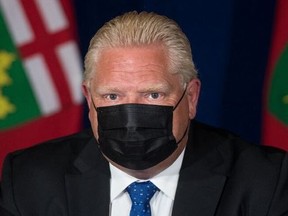 Ontario Premier Doug Ford listens to a question at a Sept. 1, 2021 press conference where he unveiled his government's plan for a vaccine passport.