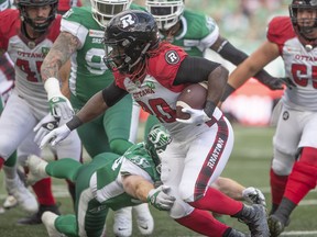Ottawa Redblacks running back Timothy Flanders (20) runs  the ball towards the end zone against the Saskatchewan Roughriders during first half CFL football action in Regina on Saturday, August 21, 2021.