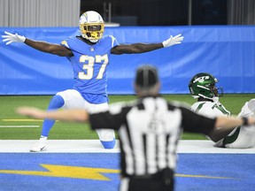 Tevaughn Campbell #37 of the Los Angeles Chargers celebrates after breaking up a pass intended for Denzel Mims #11 of the New York Jets during the second half at SoFi Stadium on November 22, 2020 in Inglewood, California.